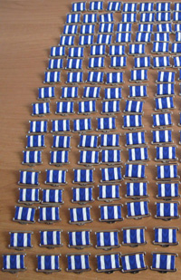 изготовление металлических значков